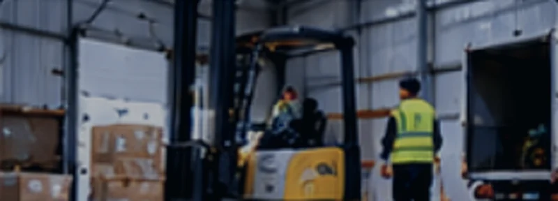 Forklift unloading a truck at the warehouse loading dock
